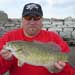 Ken Fritz with his Lake Erie Trophy Small mouth caught while fishing the south gap of Buffalo Harbor.